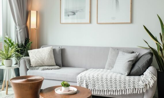 a living room filled with furniture and a large window